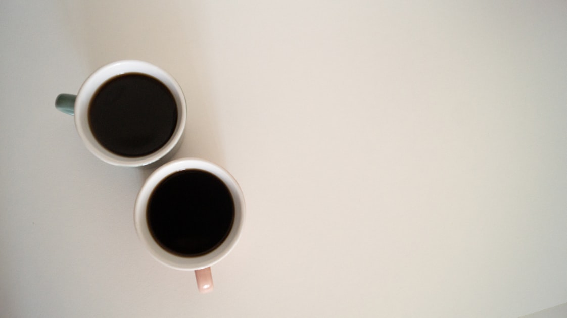 Two cups of coffee ready to be enjoyed.