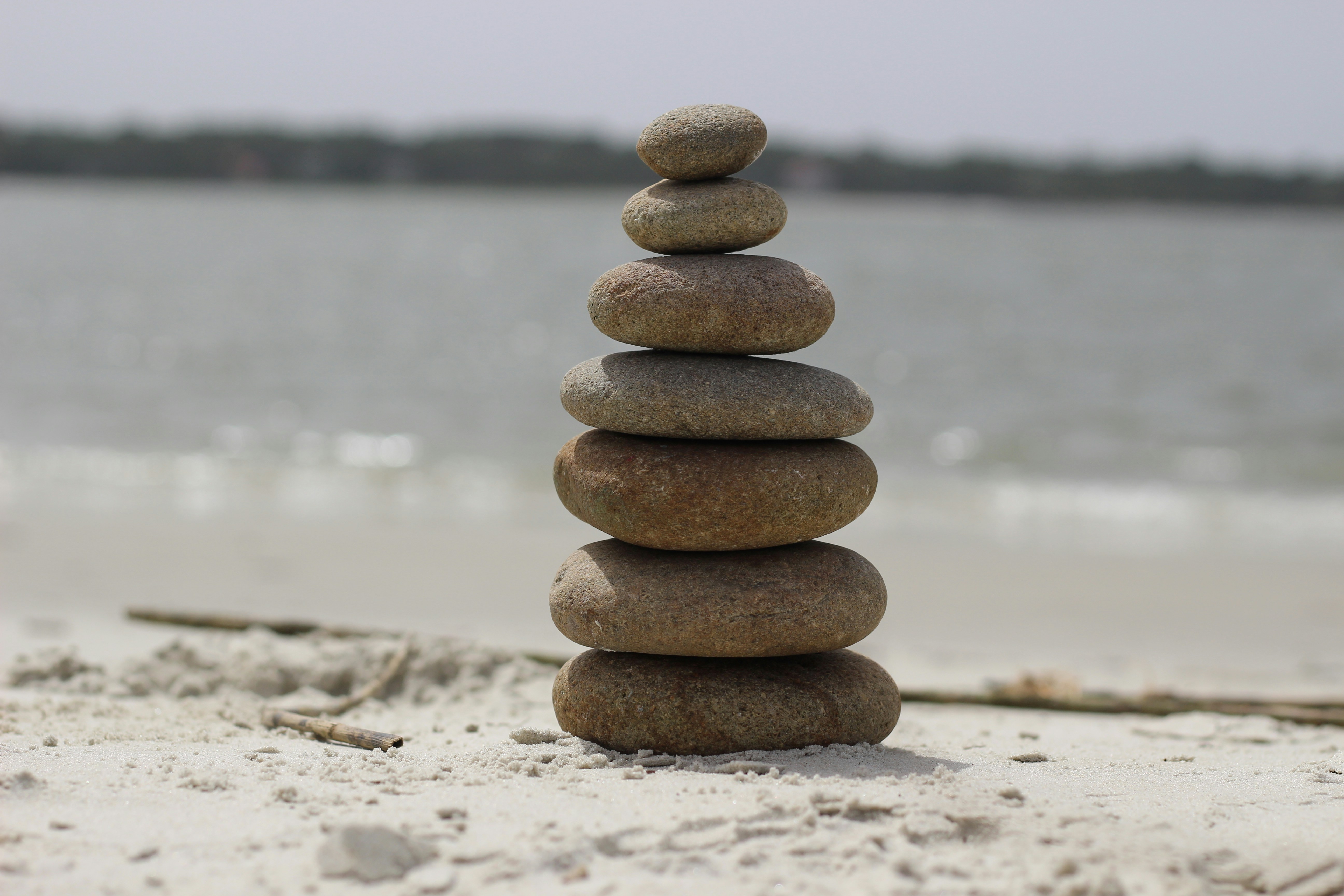 Stones are perfectly stacked on a beach