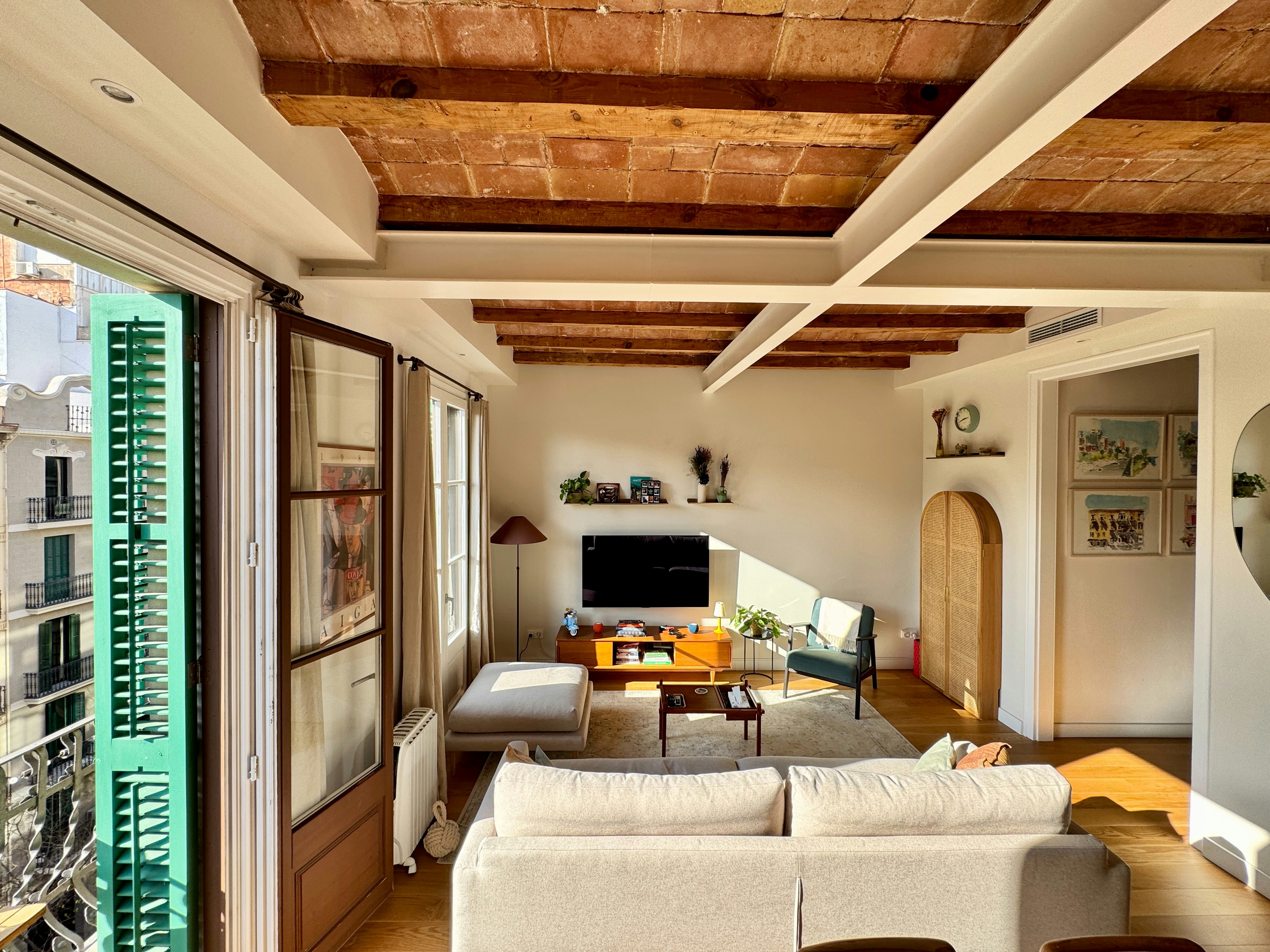 Cozy living room with exposed brick ceiling.