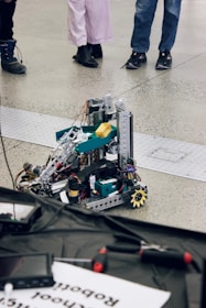 Robot prototype is being viewed by people.