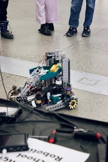 Robot prototype is being viewed by people.