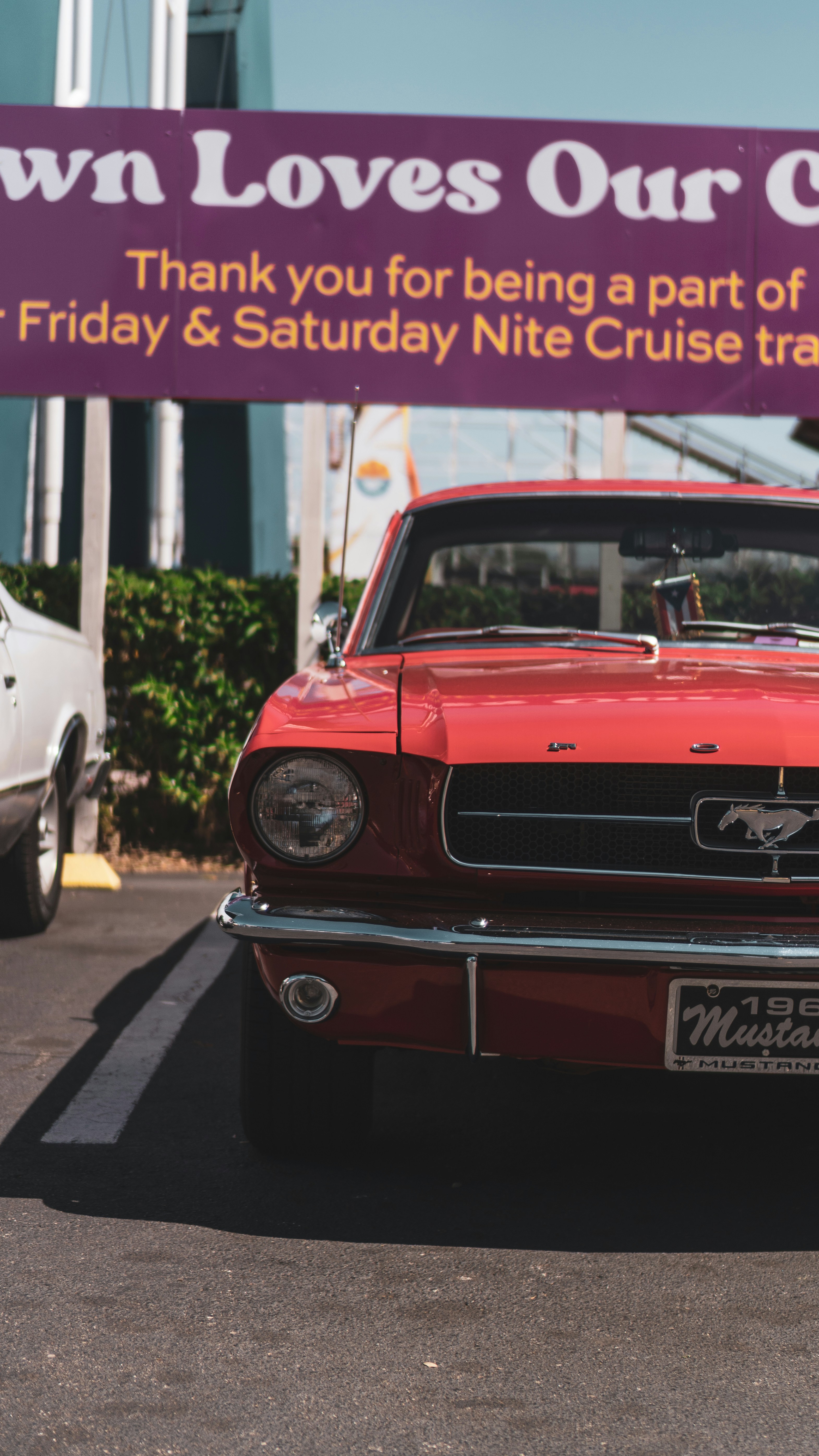 A classic red mustang is featured in this photo.