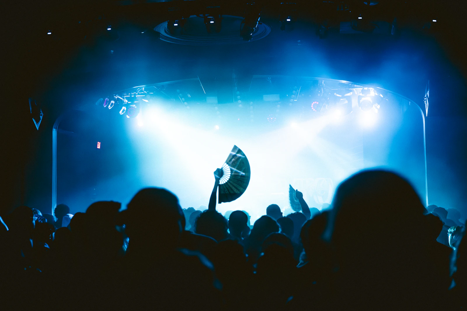 A concert stage is lit up in blue