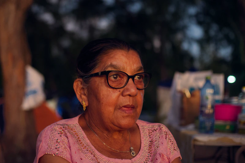 Focused Indian woman, potential sugar momma, wearing glasses