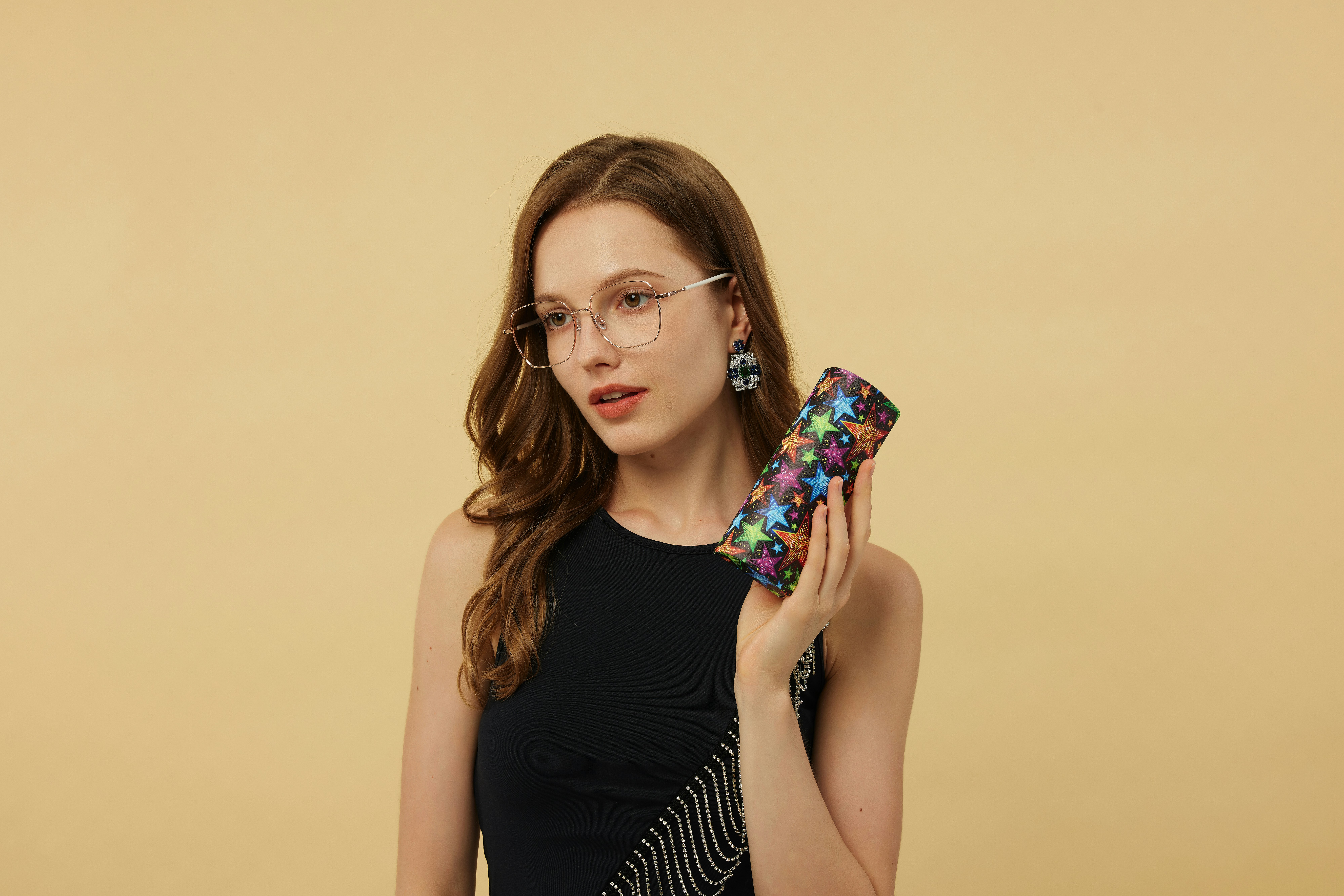 A fusion of retro charm and contemporary style, these black square glasses feature a glossy finish and subtle metal detailing. The strong frame adds depth to the face, creating a striking look. Teamed with a blue printed blouse, these glasses make an ideal accessory for anyone looking to balance vintage flair with modern sophistication.