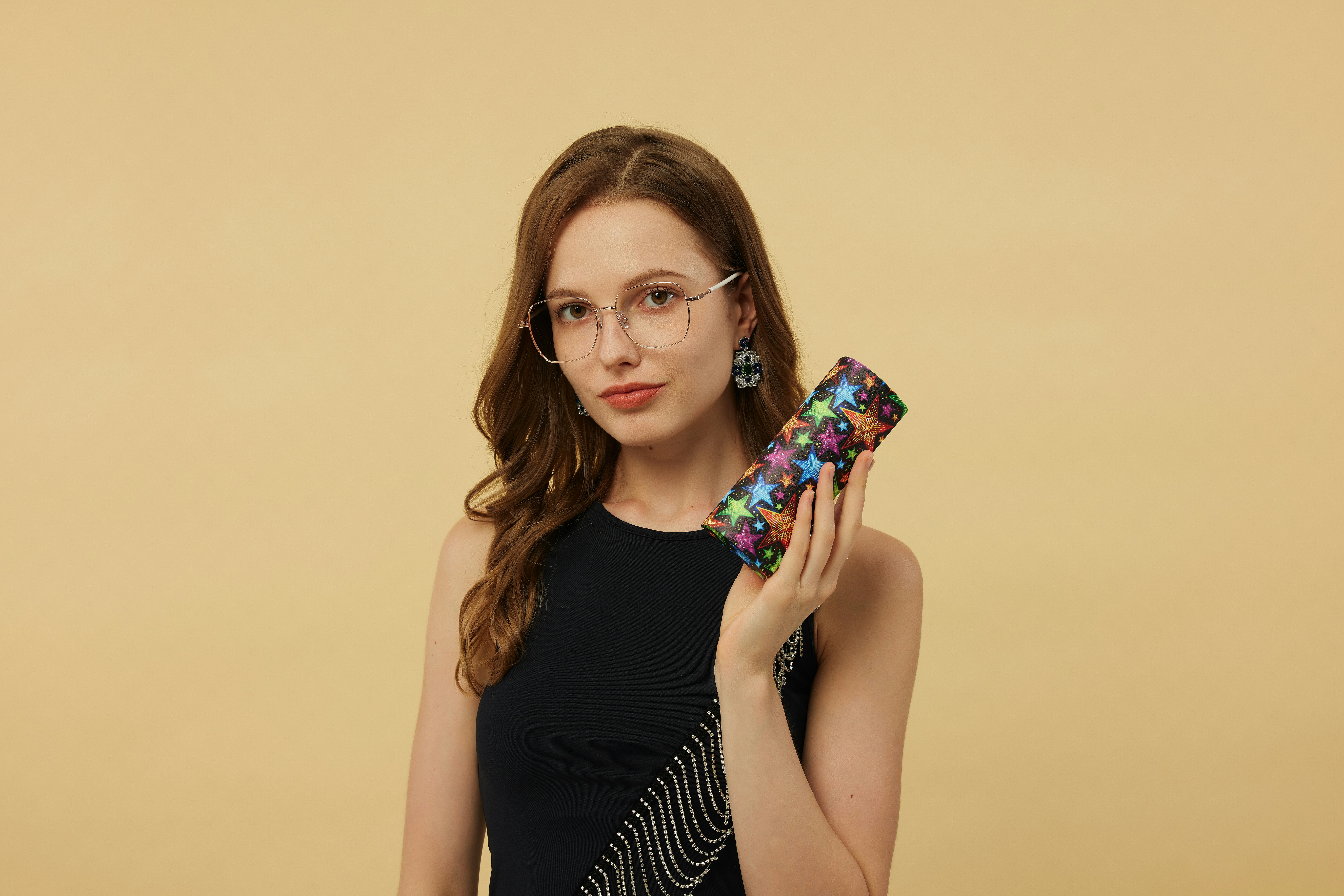 These oversized black browline glasses make a bold fashion statement. Their thick, structured frame enhances facial features while offering a professional yet trendy appearance. Worn with a vibrant blue patterned blouse, they exude confidence and charisma, making them a perfect choice for both work and casual outings.