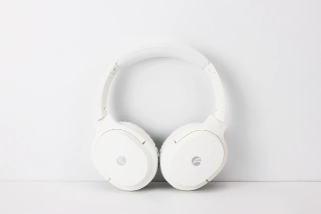 White headphones against a white background.