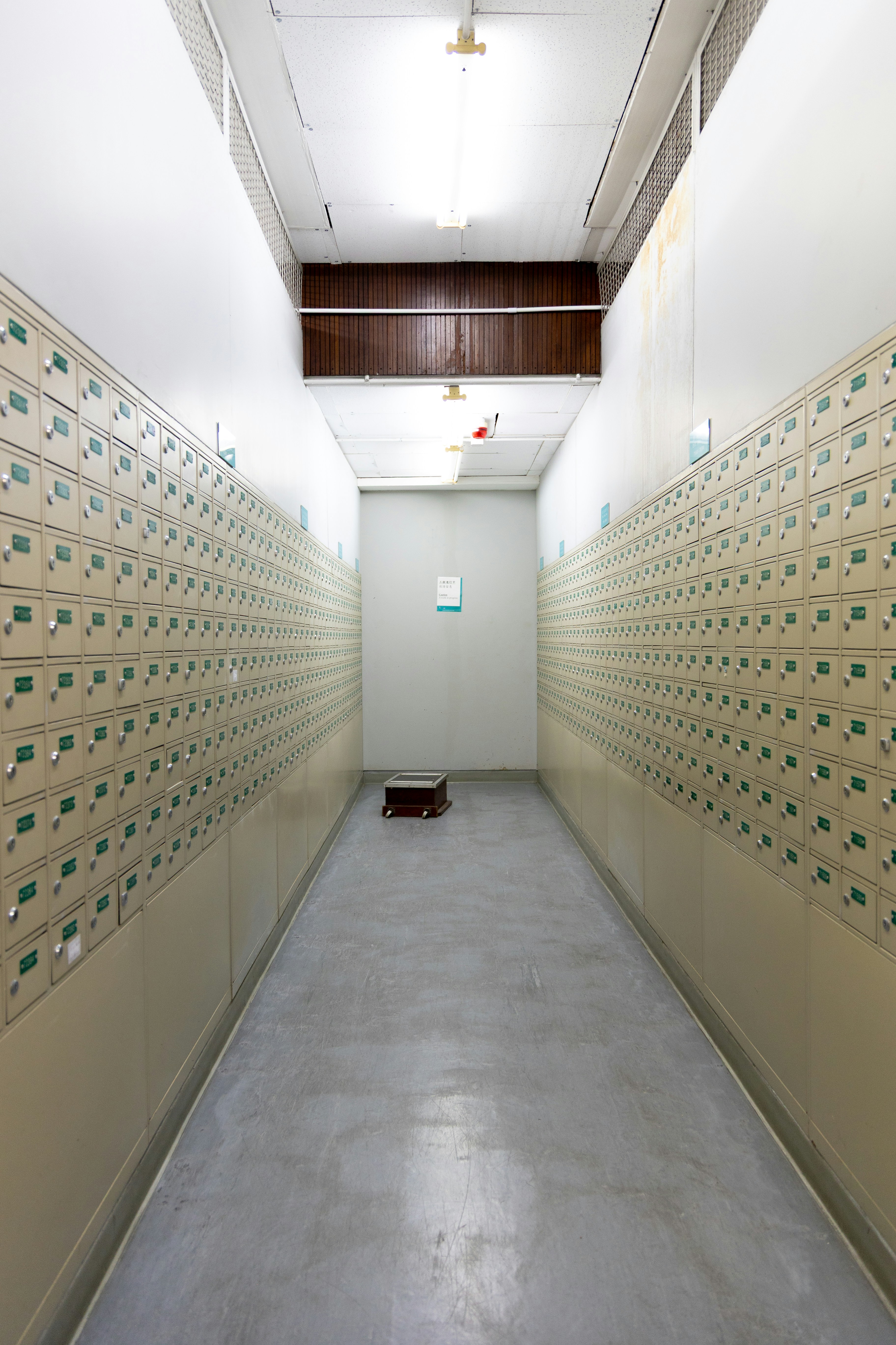 Long hallway lined with deposit boxes.