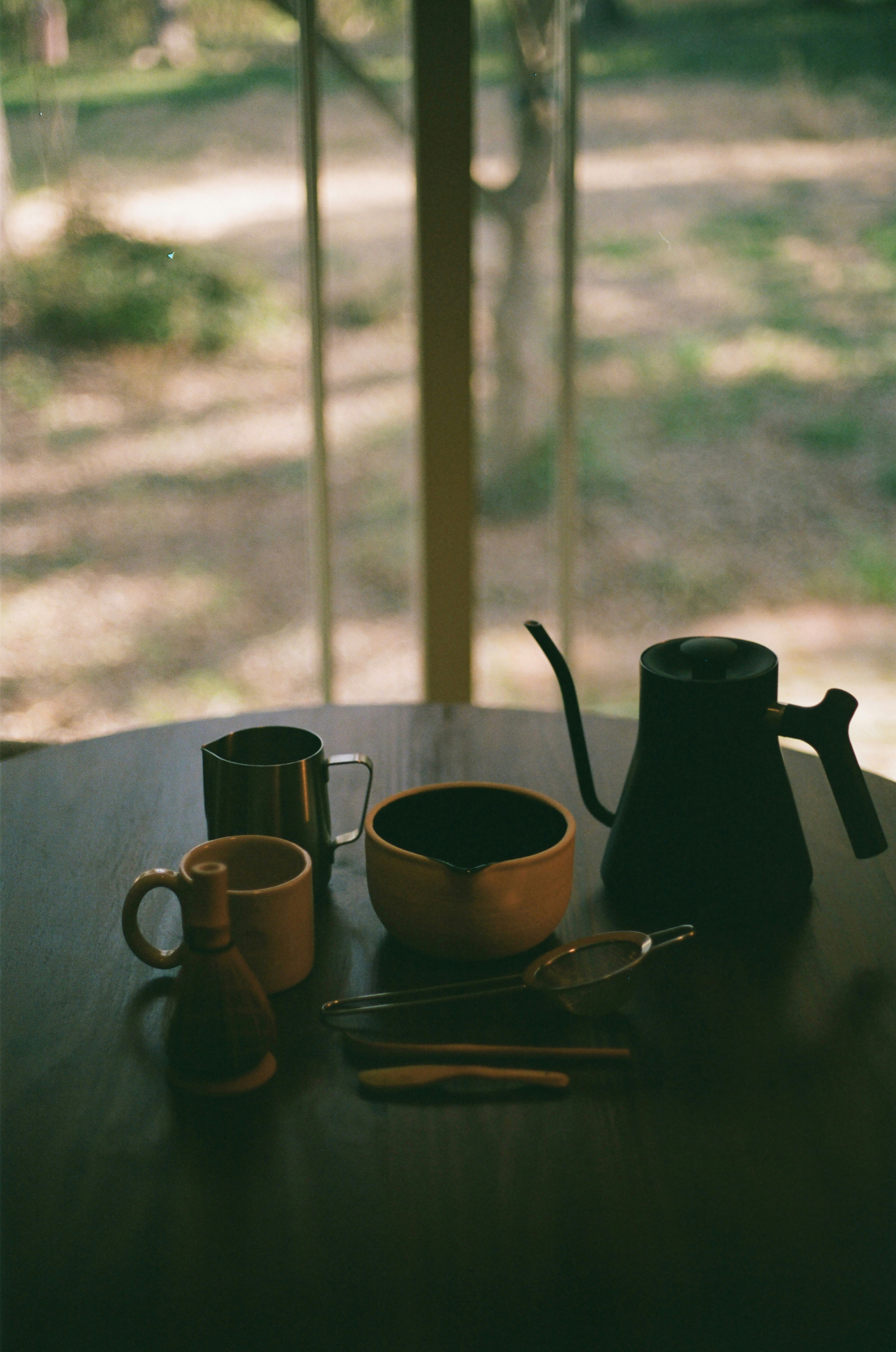 Cup of black coffee and green tea on a table