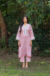 Woman models a matching floral kurta and pants.