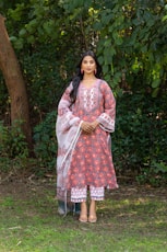 Woman wearing a traditional indian outfit outdoors.