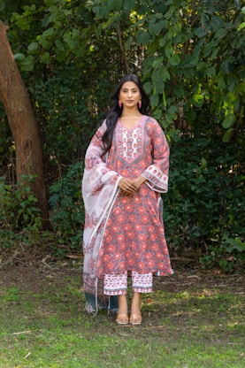 Woman wearing a traditional indian outfit outdoors.