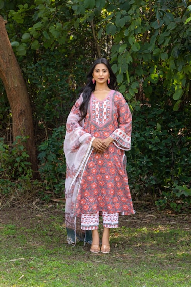 Woman wearing a traditional indian outfit outdoors.