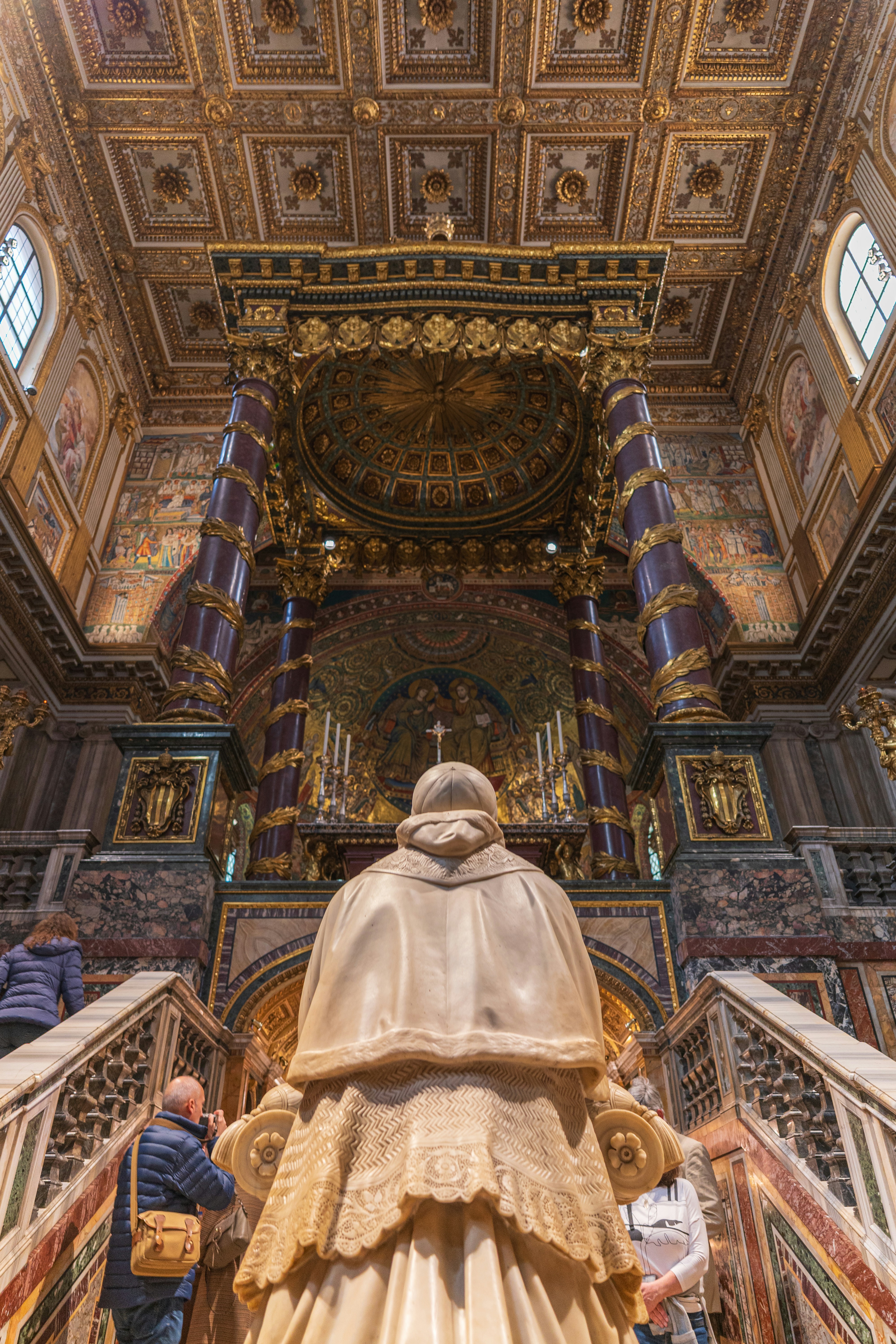 People admire the opulent interior of a church