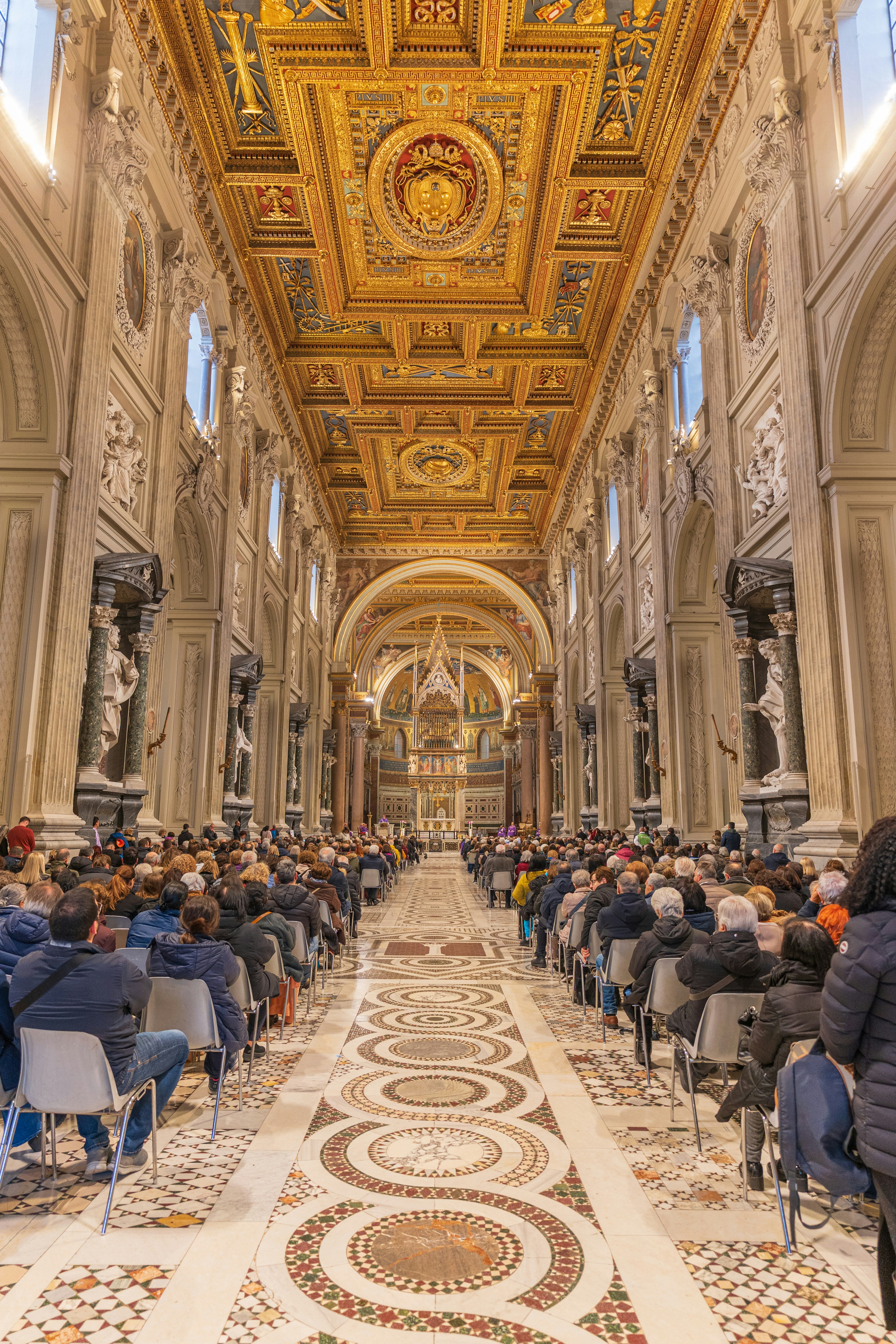 People sit in church during a ceremony