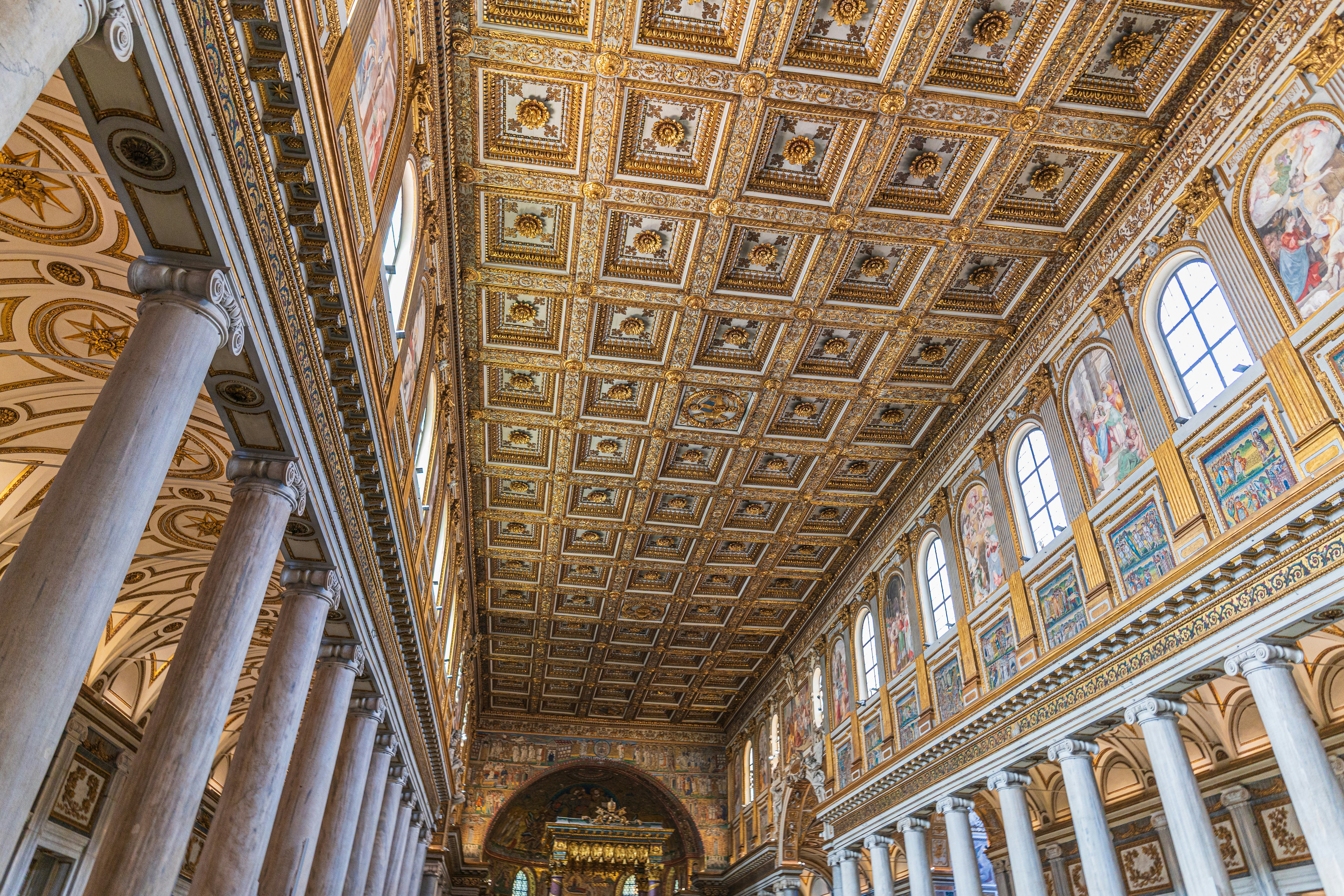 Ornate ceiling and columns in a church.