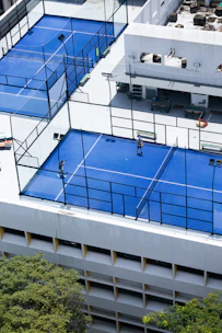 Two padel courts on a building rooftop