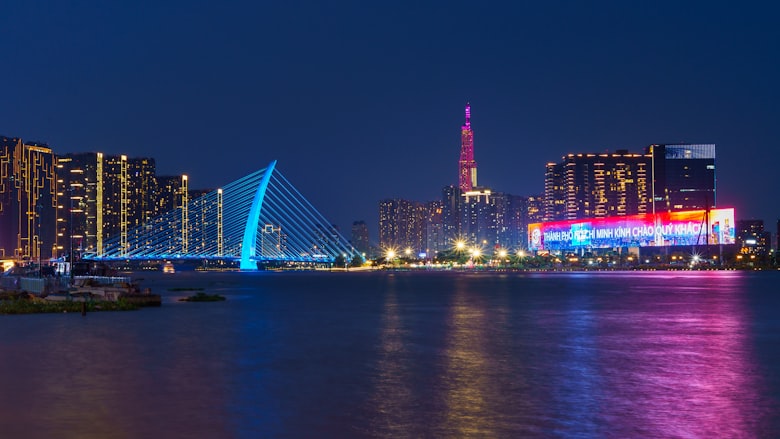 Modern high-rise apartments along the Saigon River in Ho Chi Minh City at dusk