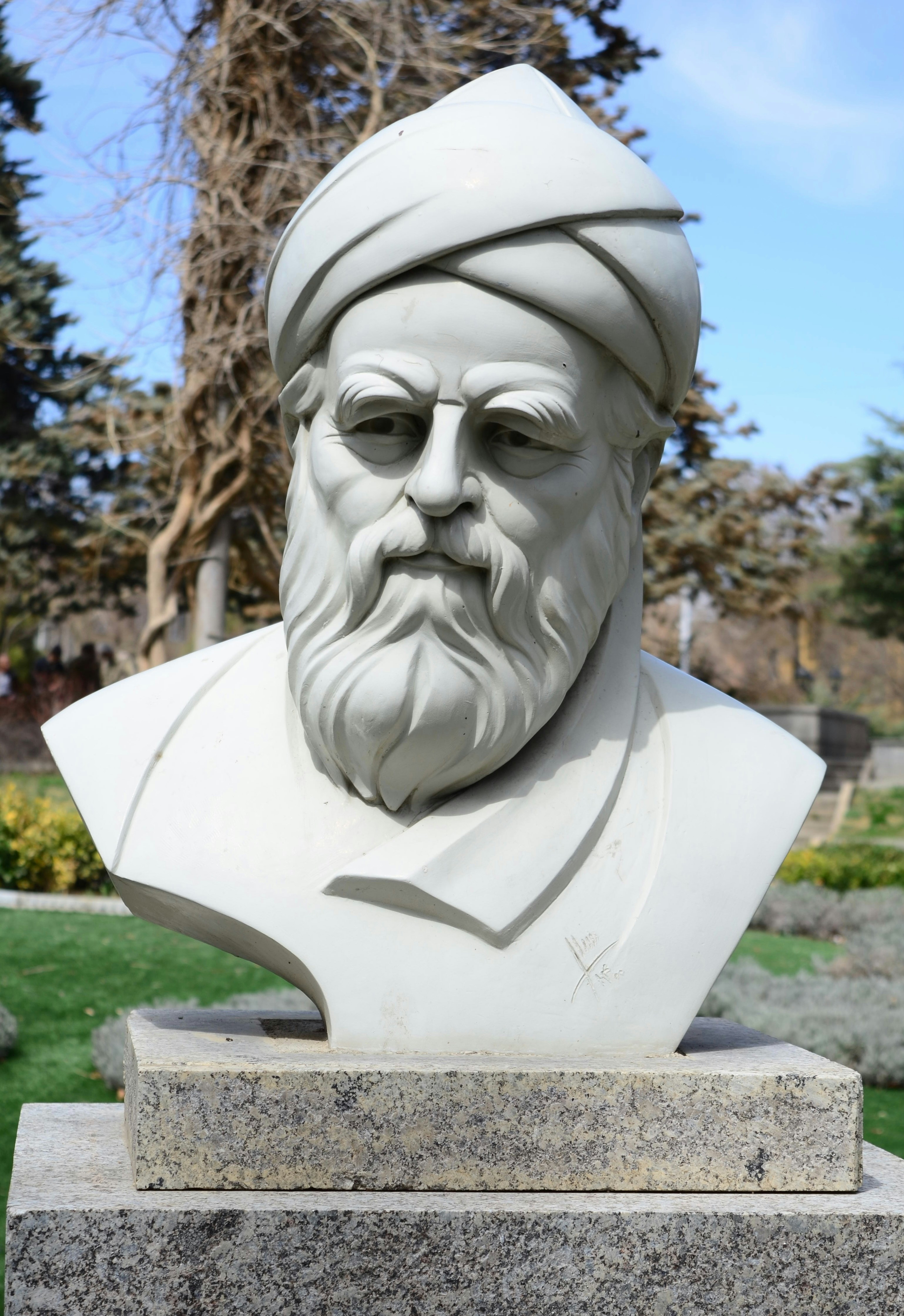 A white marble bust of a man.