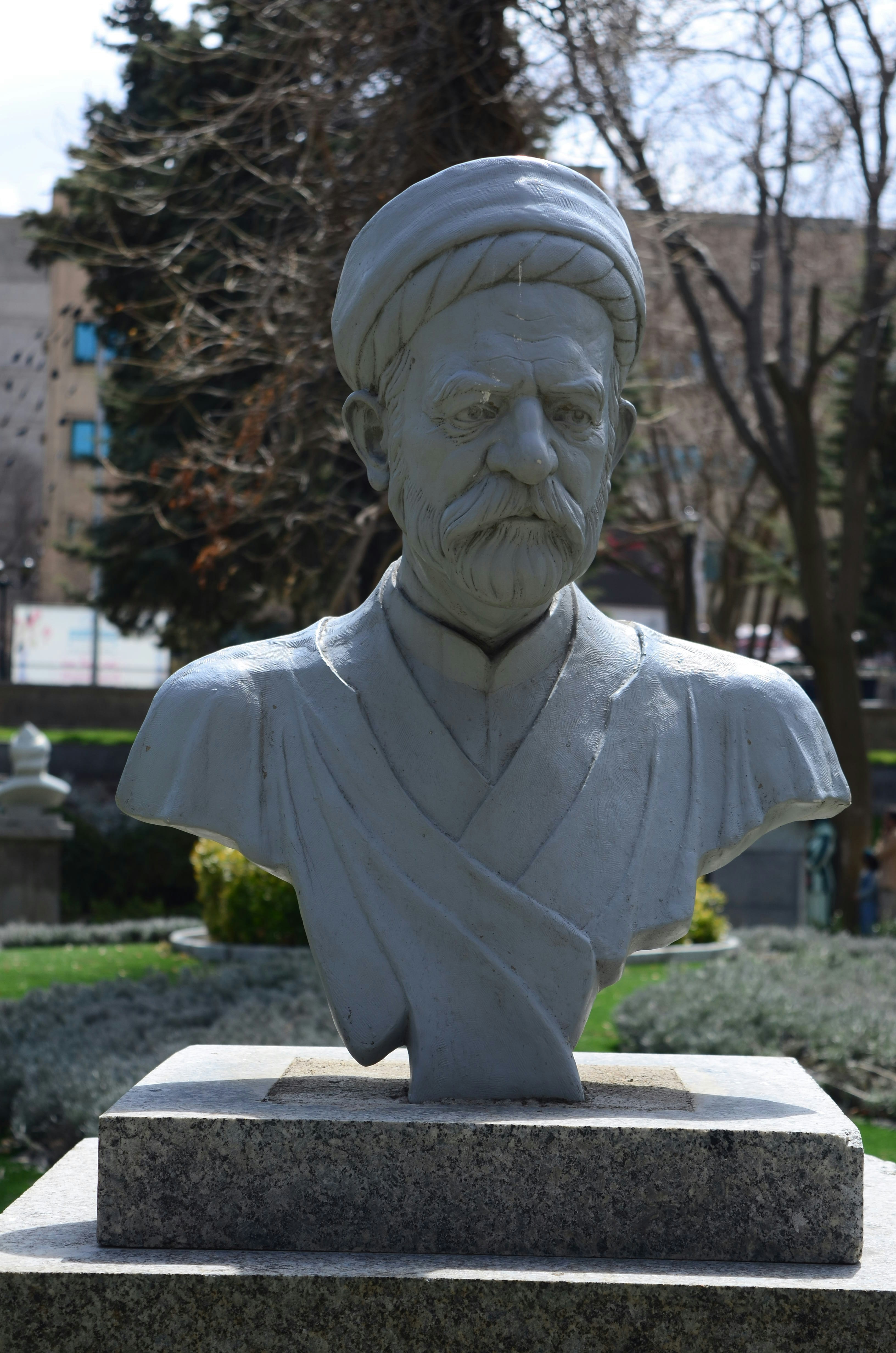 A statue bust of a man in a turban.