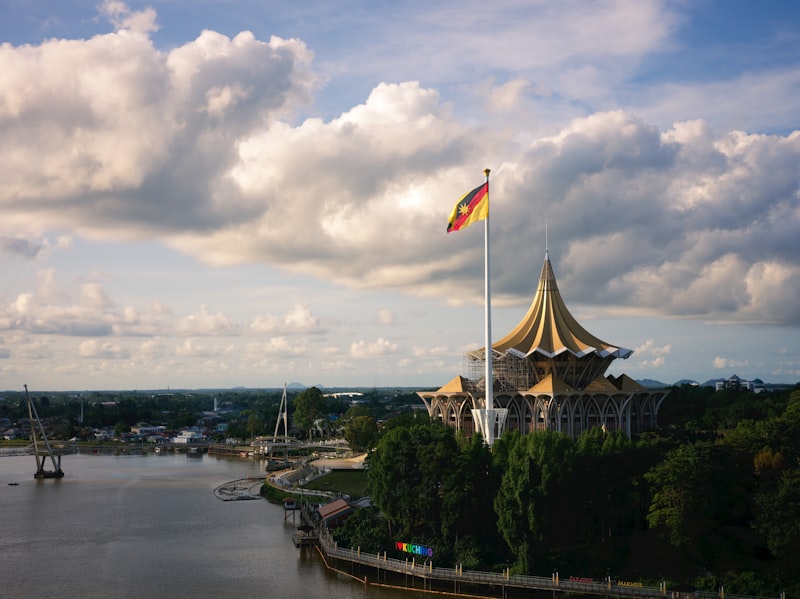 A beautiful building with a flag flies high.