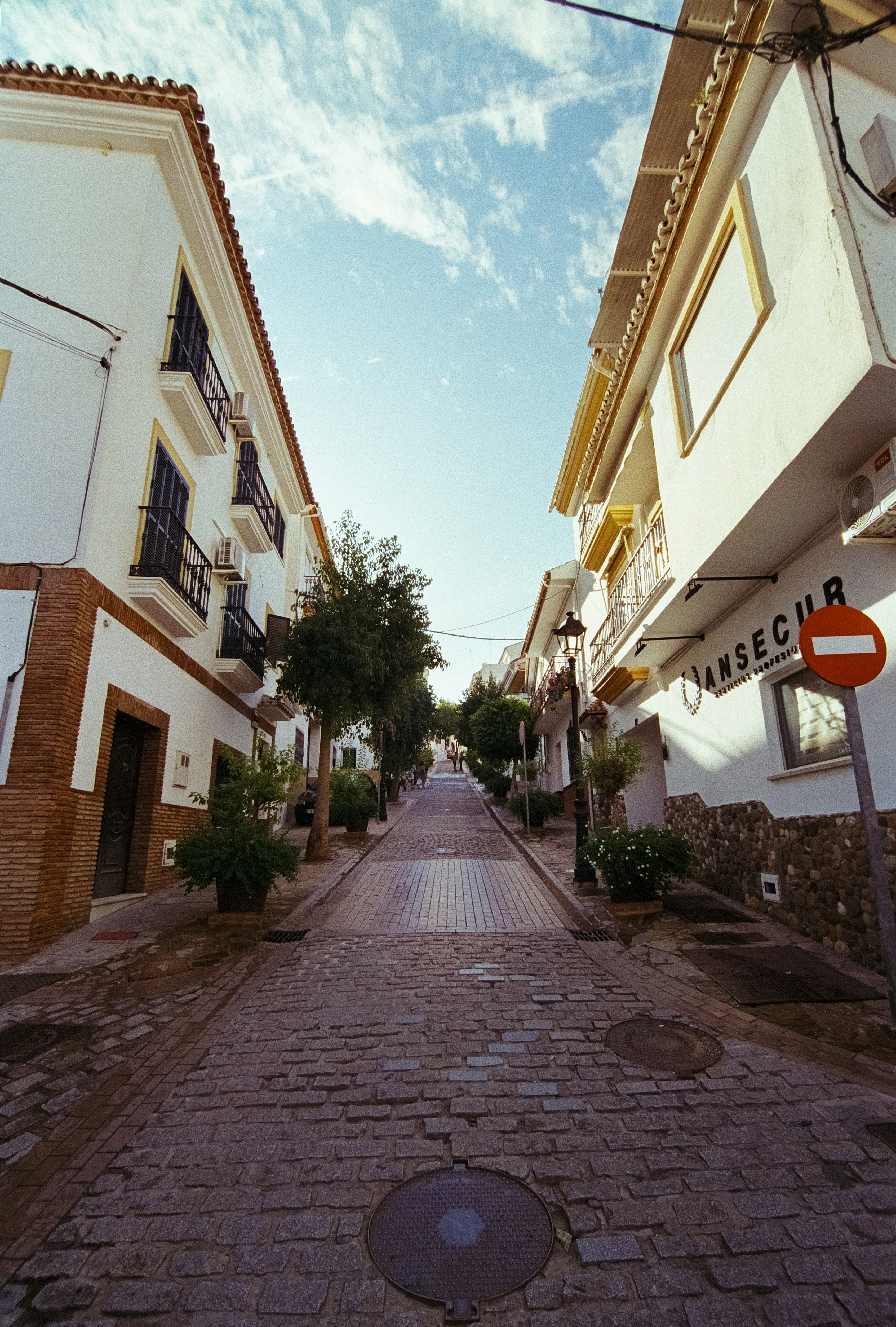 A cobblestone street in a quaint european town.