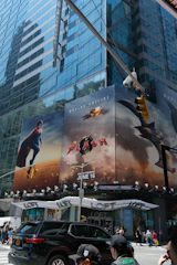 Movie billboards advertising the flash are shown.