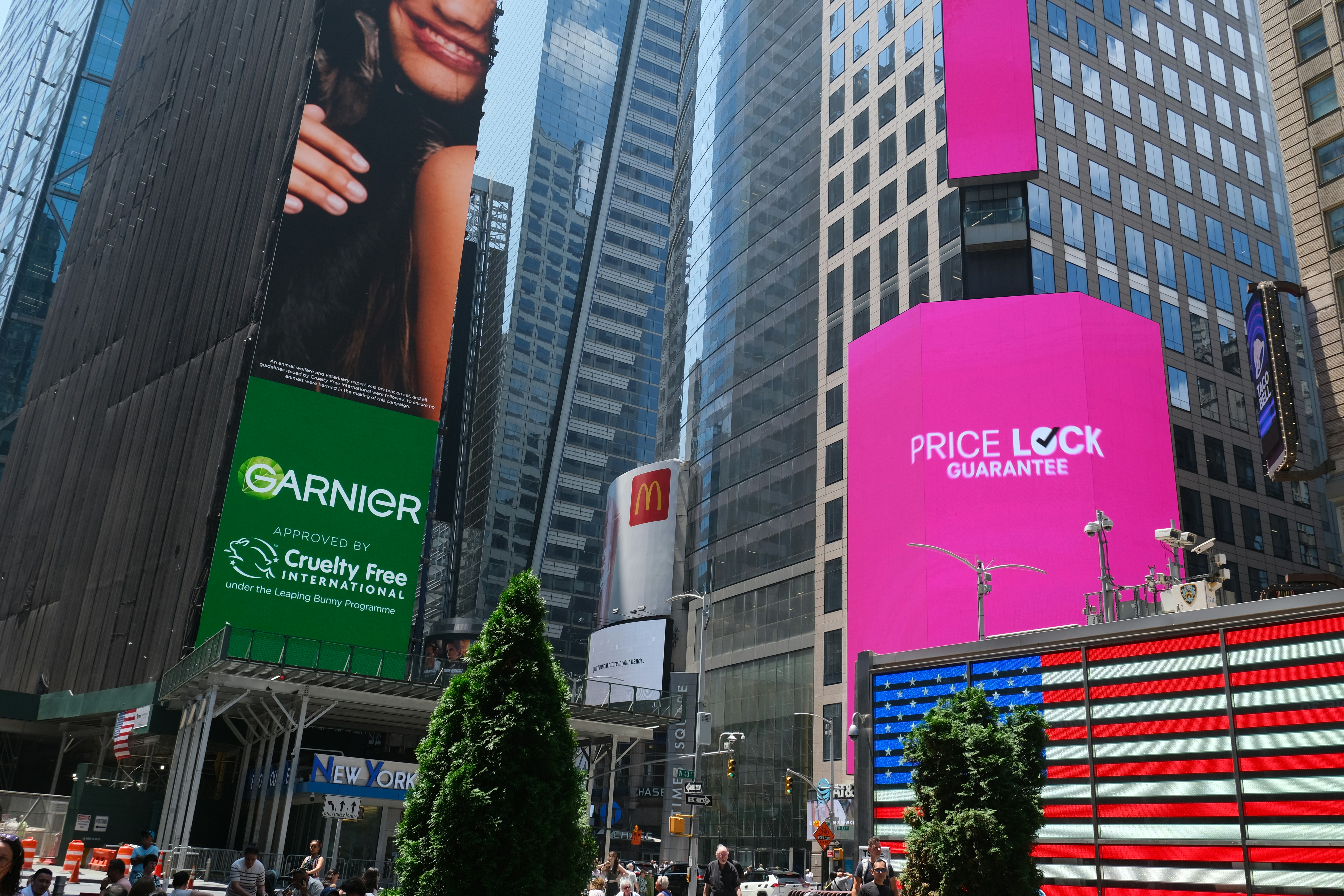 Times square shows vibrant signs and towering buildings.