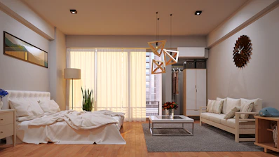 A beautifully furnished bedroom and living room combo.