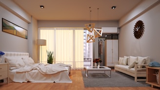 A beautifully furnished bedroom and living room combo.