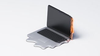 Melting laptop symbolizes overheating or malfunction.