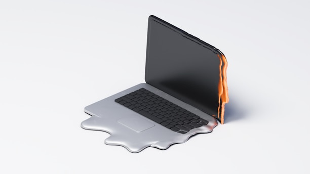 Melting laptop symbolizes overheating or malfunction.