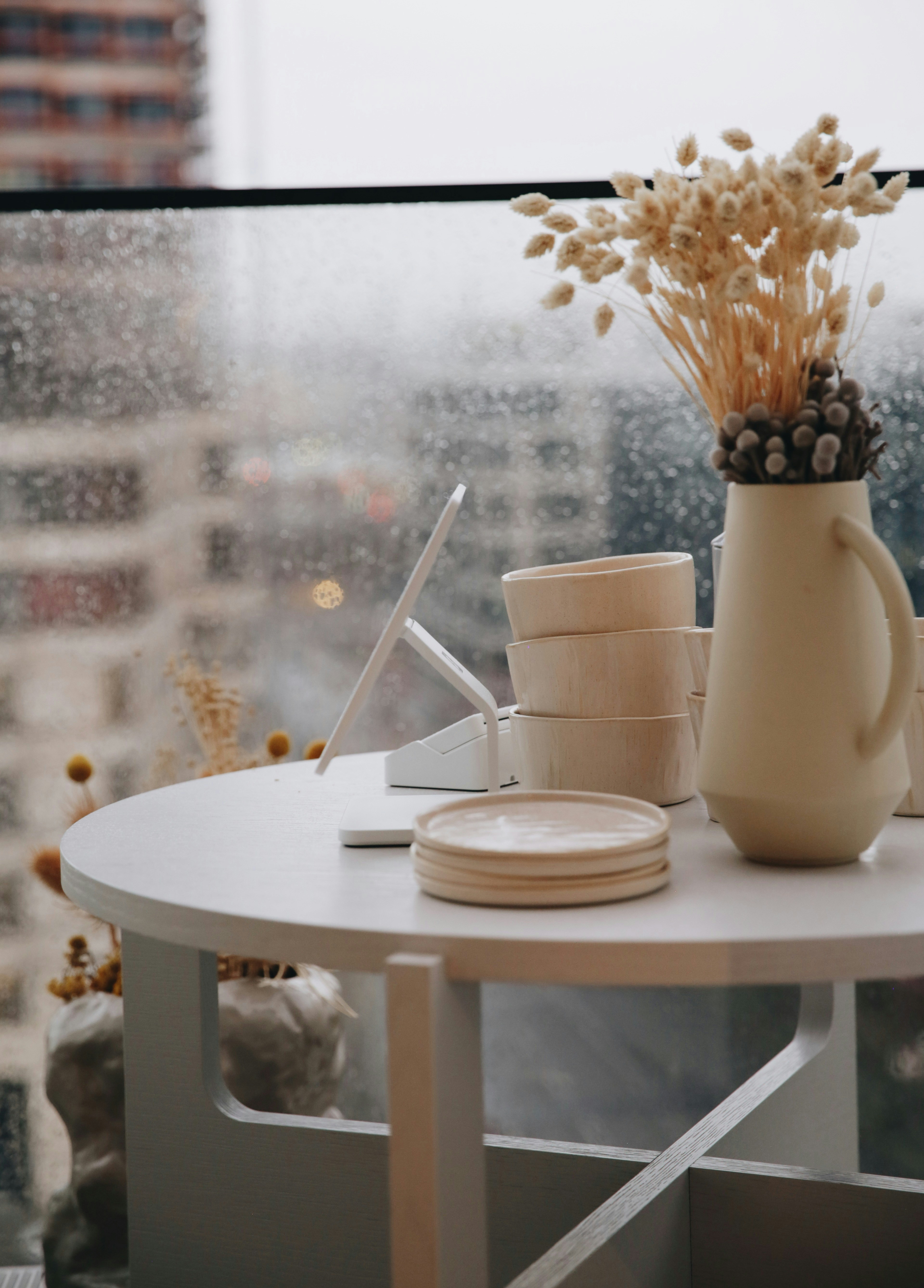 Table set with ceramics and a floral arrangement
