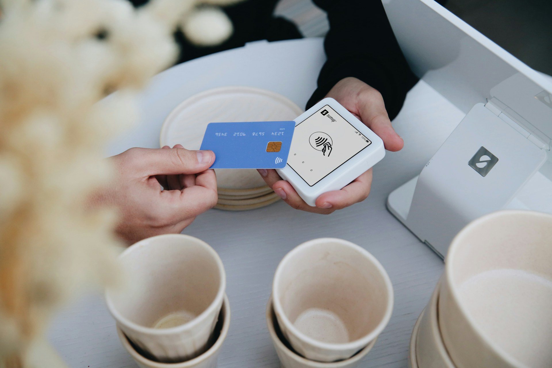 Paying with a credit card at a register.