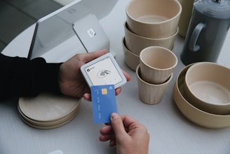 A person uses a credit card to pay.