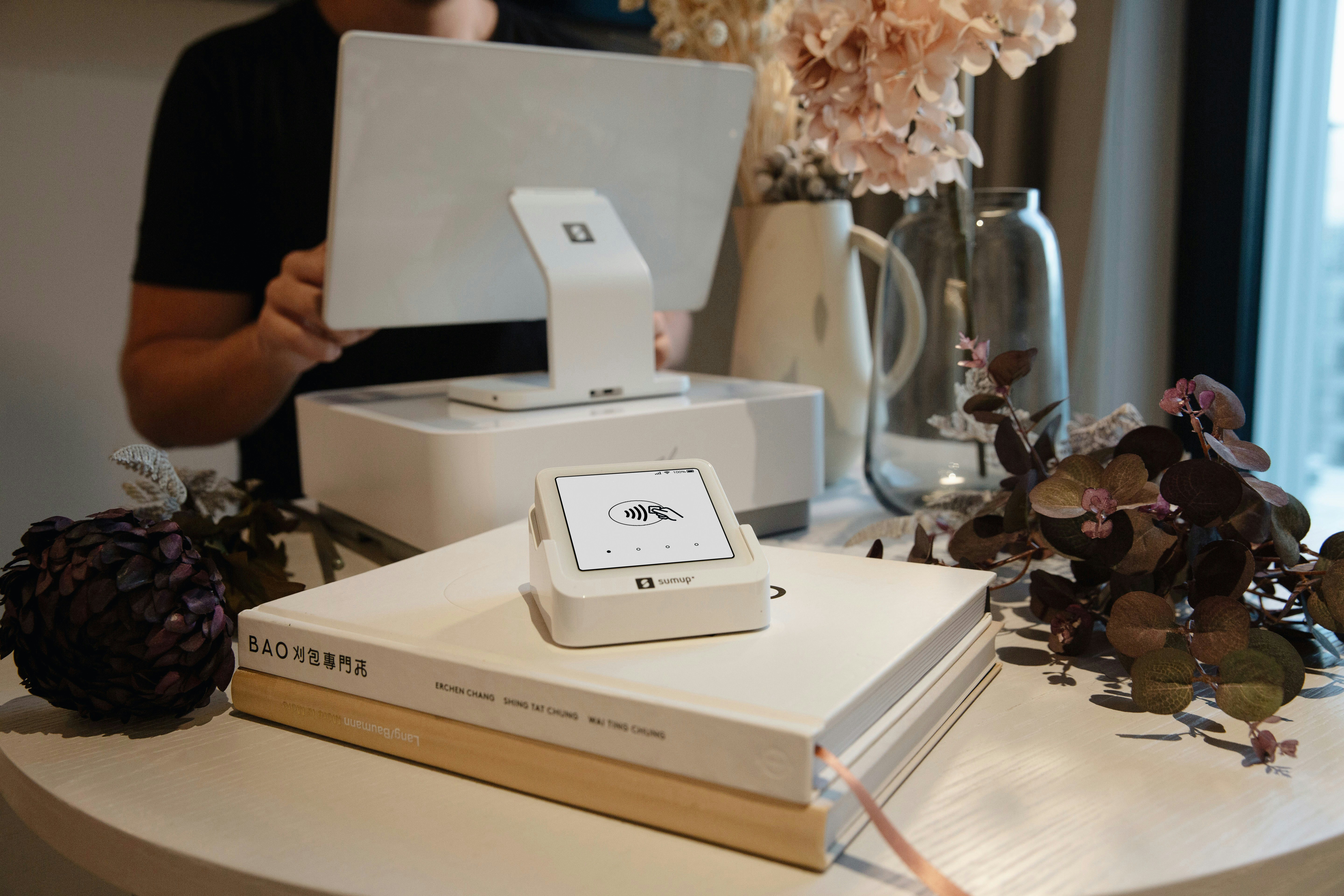 A pos system setup on a decorated table.