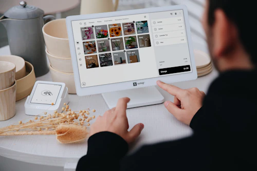 Small business owner using modern point-of-sale technology