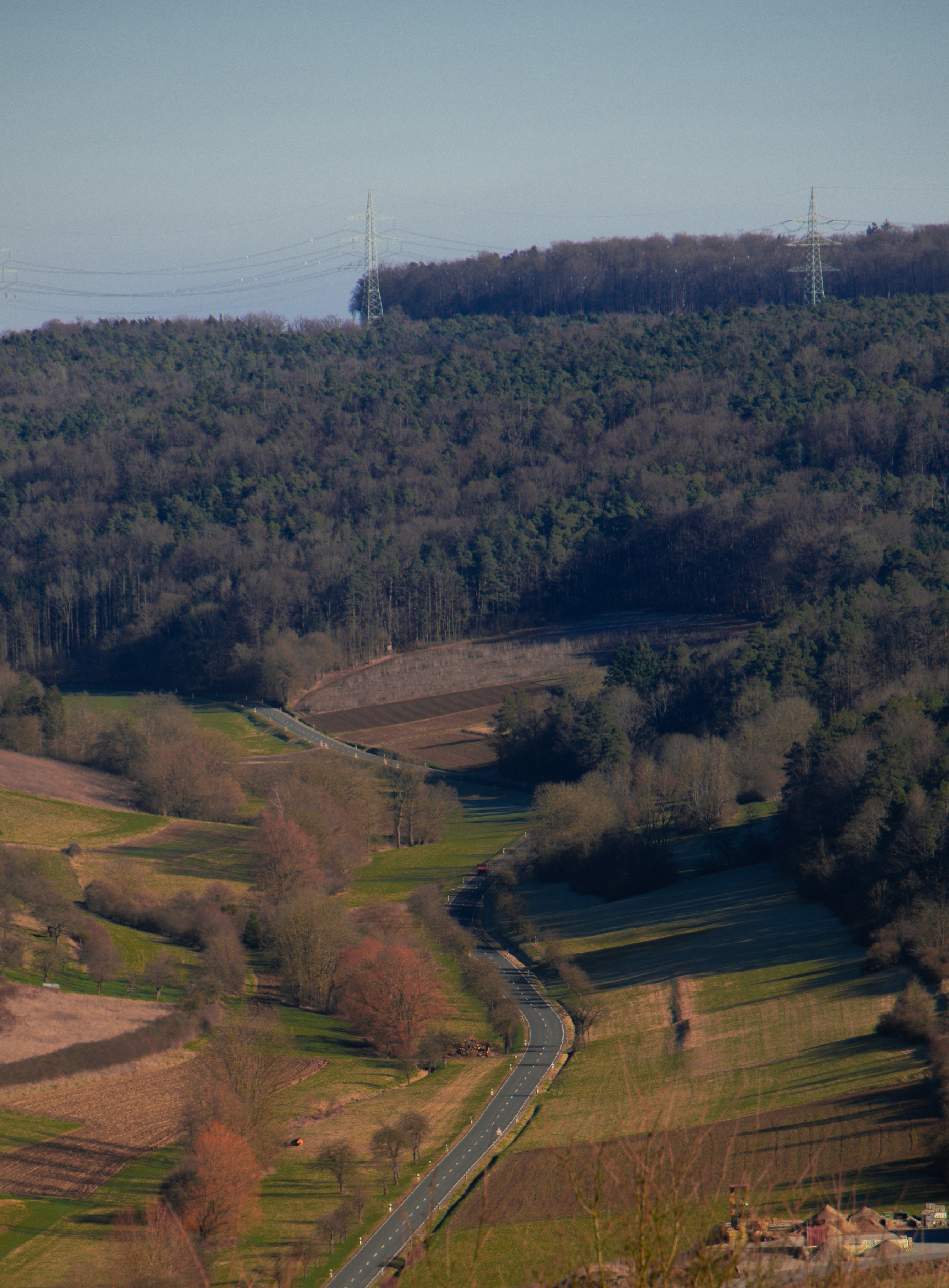 Rolling hills and a winding road through the countryside
