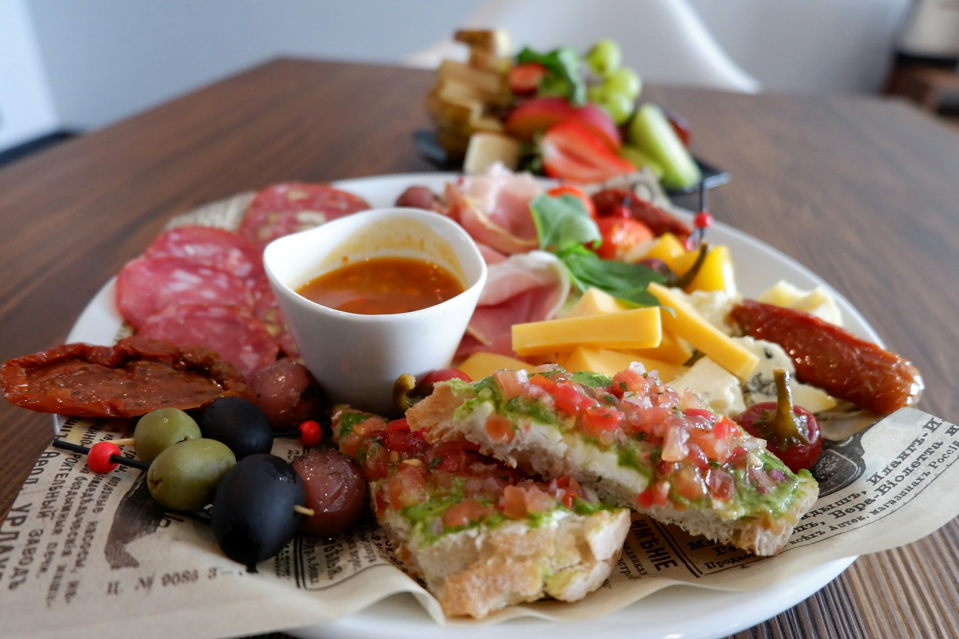 A delicious charcuterie board with a variety of snacks.