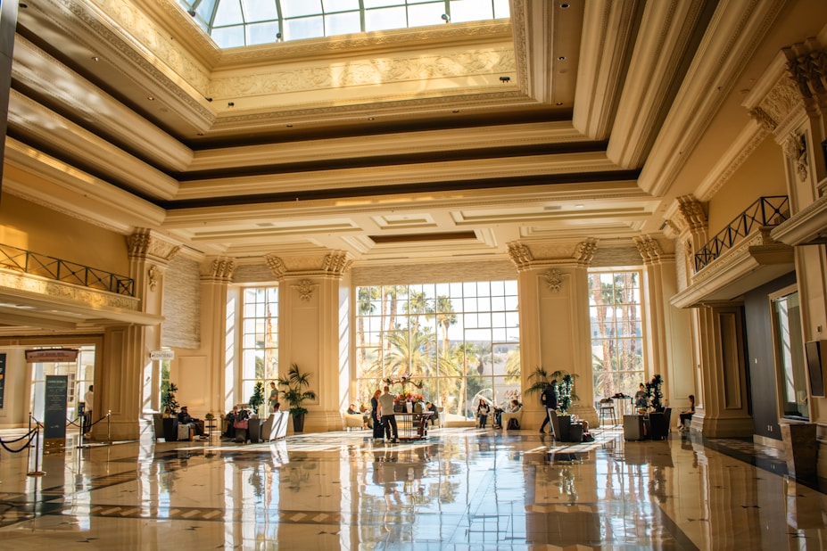 An elegant, well-lit lobby with tall pillars.