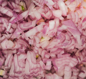 Finely chopped red onions ready for cooking.