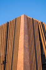 Building corner with vertical wooden slats.