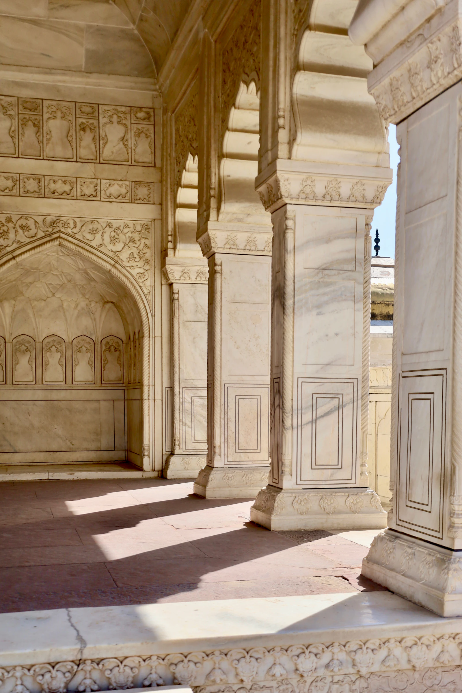 Elegant marble columns casting long shadows
