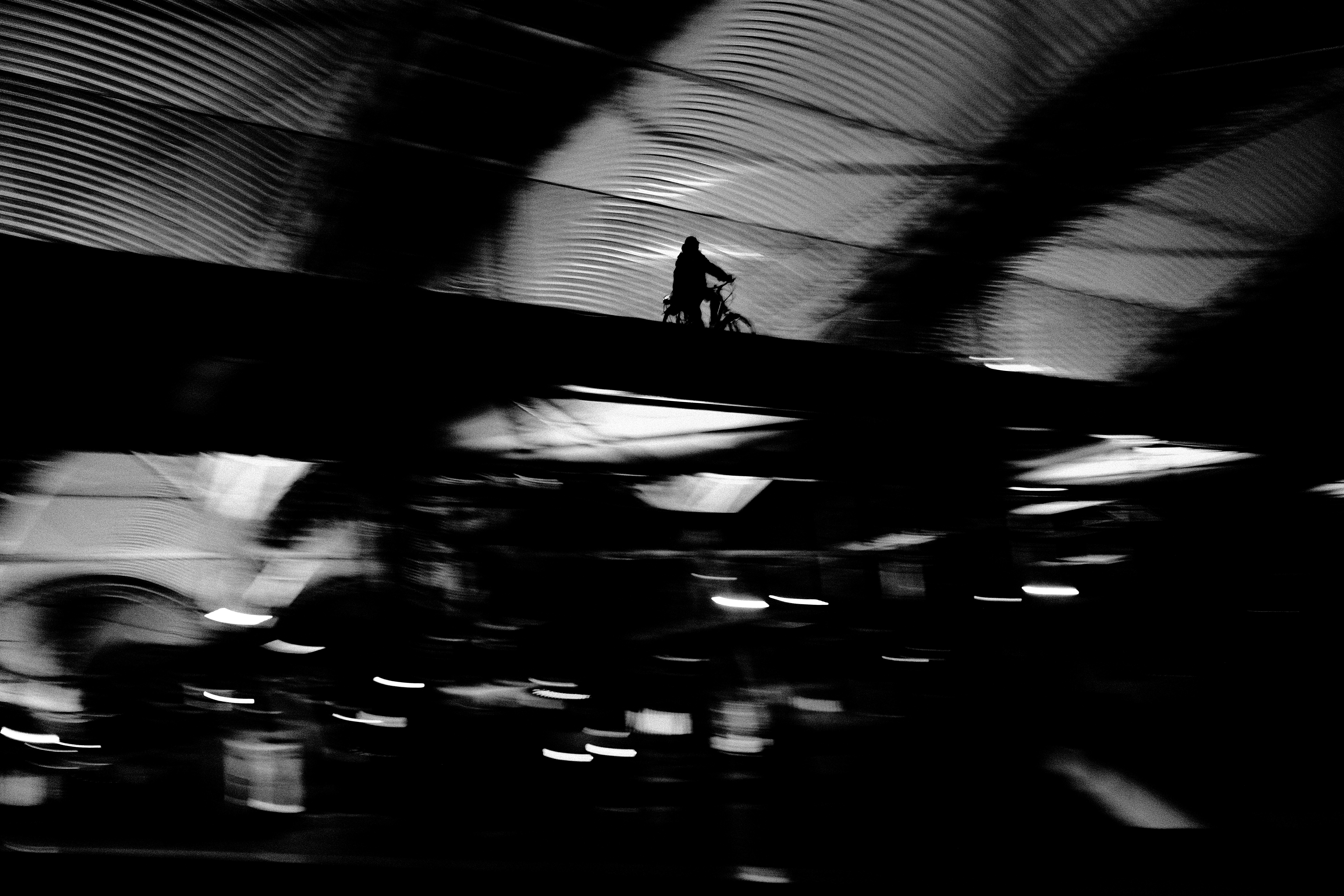silhouette against a concrete wall