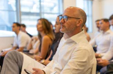 A group of people attend a business conference.