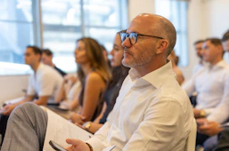 A group of people attend a business conference.