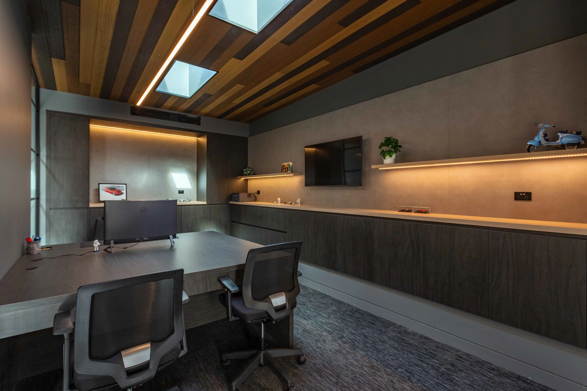 Modern office with wooden ceiling and sleek furniture.