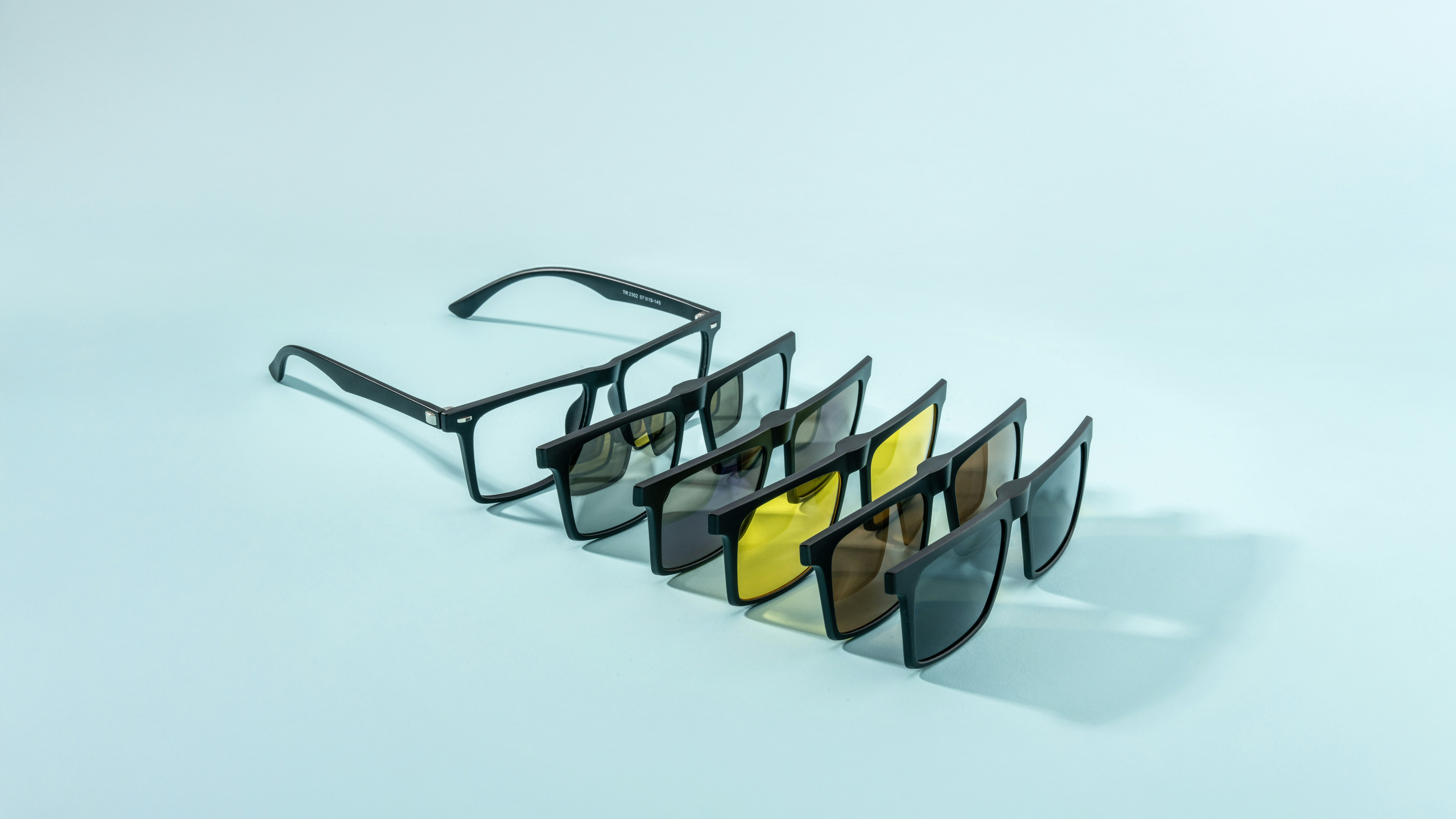 Glasses with various magnetic lens attachments.
