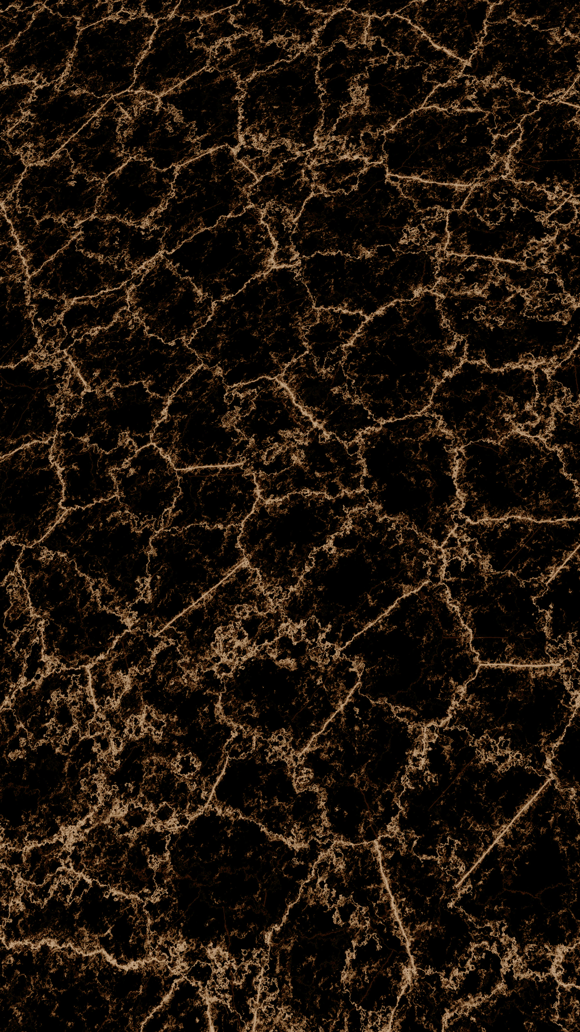 A dark cracked surface shot through with fine veins of gold