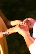 Couple holding hands with affection and support.